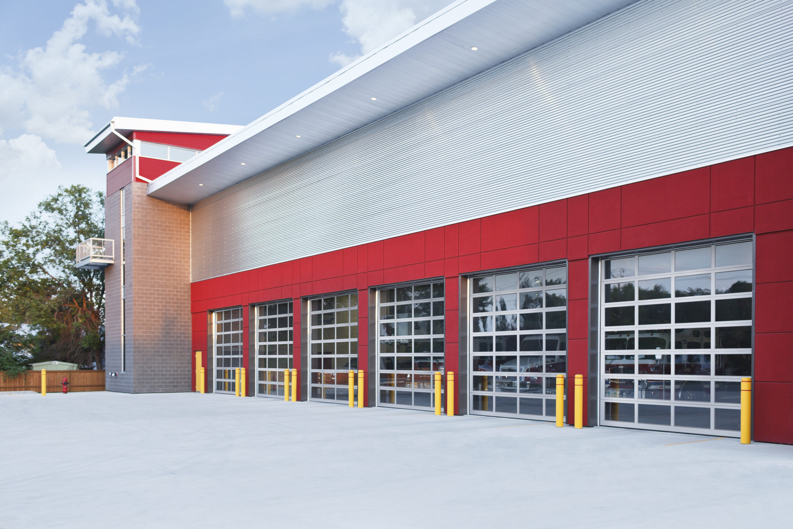 Modern fire station with red and gray exterior.