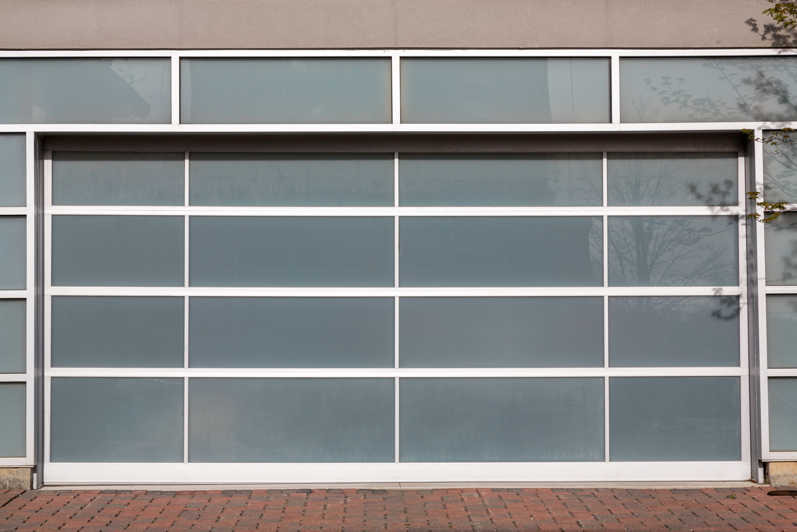 Modern frosted glass garage door closed.