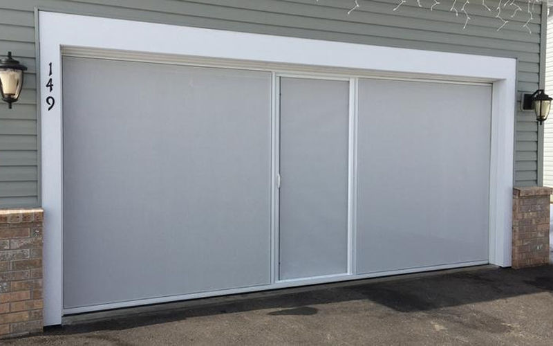 White garage door with house number 149.
